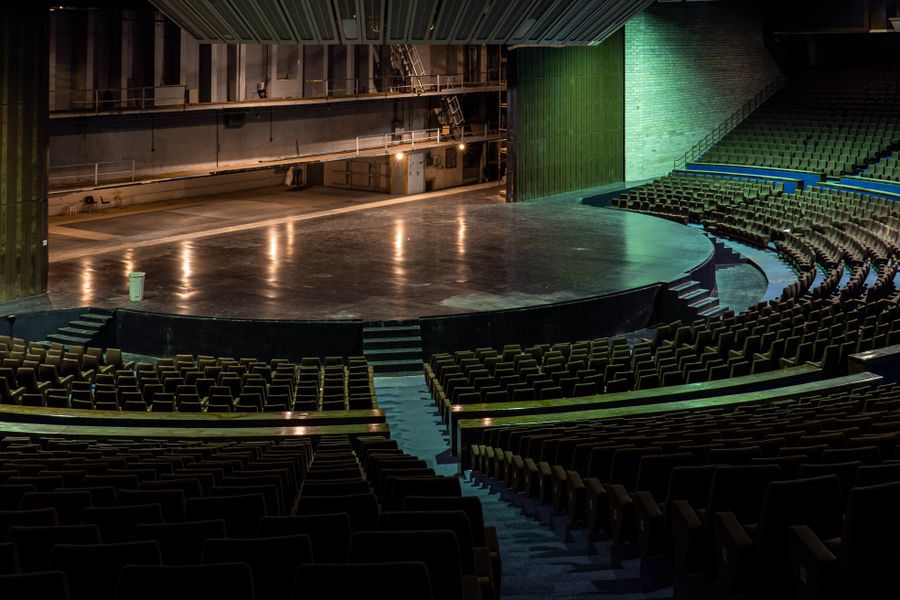 An empty auditorium looking towards a theatre stage